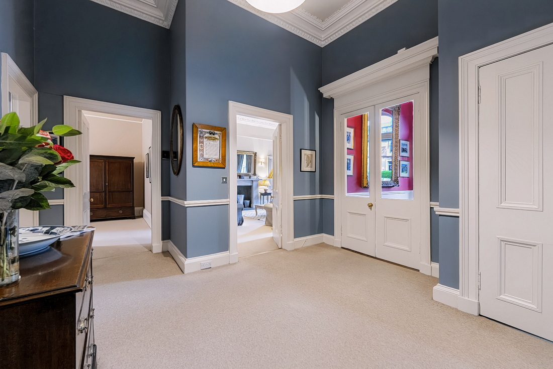 The inner hall with its antique chest of drawers, period doors and cornicing