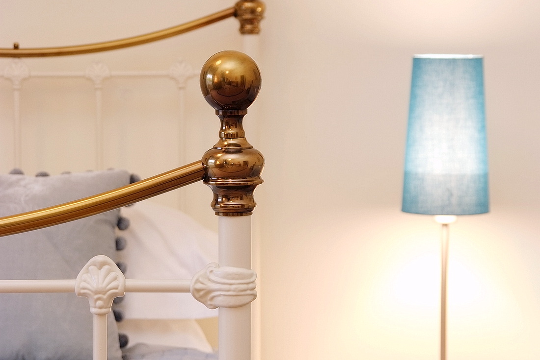 Brass bedstead detail in the twin room