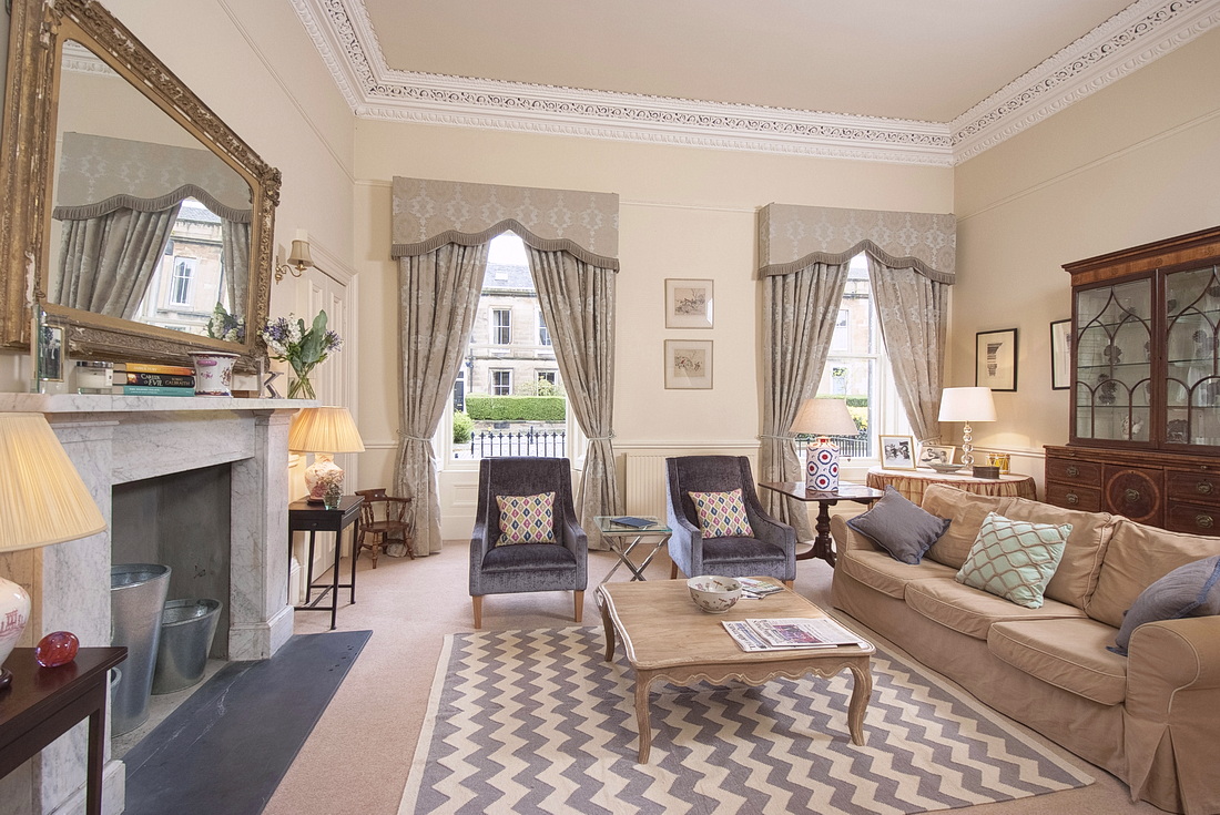 Drawing room with marble fireplace and gilt mirror